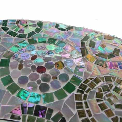 Close up of round mosaic mirror